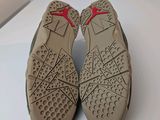 the soles of a pair of shoes on a white surface