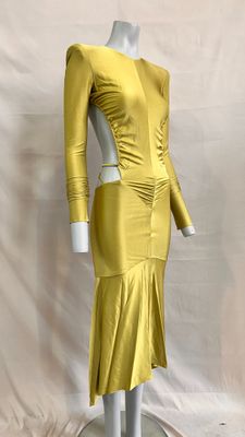 the mannequin is wearing a yellow dress with long sleeves