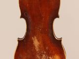 an old violin with a wooden back and a brown body