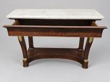 a marble top coffee table on a stand with a drawer underneath it