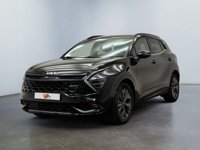 a black suv parked in a room with a white wall