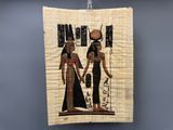 an egyptian papyrus painting with two women and a child