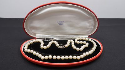 an image of a pearl necklace and bracelet in a red case