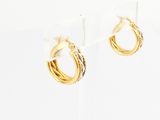 two tone gold hoop earrings on a white background
