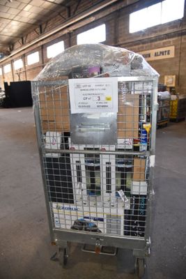a metal cage with a sign on it in a warehouse