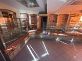 a glass display case in the middle of a room