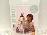 the box is open to show the contents of the doll house