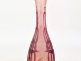 pink glass vase with a design on the body of a woman