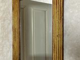 a mirror on the wall above a sink in a bathroom