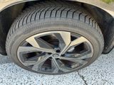 a close up of a car ' s tire on the ground
