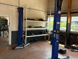 an image of a garage with a lot of tools on the floor
