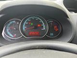 a close up of a car dashboard with a speedometer and gauges