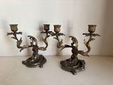three candles that are sitting on a table