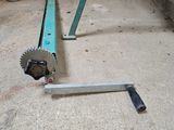 a machine that is sitting on the ground next to a table