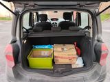 a trunk of a car with a lot of boxes in it