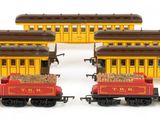 three toy trains that are sitting on a white surface
