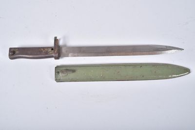 a knife and a knife holder on a white surface