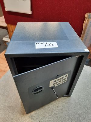 a safe box that is open on a table