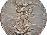 a close up of a silver coin with an angel on it