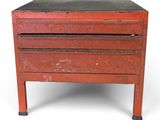 an old red chest of drawers on a white background