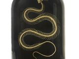 an image of a black and gold snake in a glass dome
