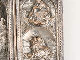 a silver plaque with a picture of jesus and other religious figures