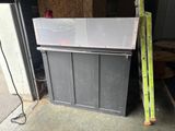 an image of a refrigerator in a garage with the door open