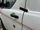 a white van parked on the side of the street