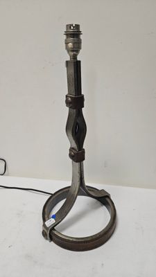a lamp that is sitting on a table with a cord