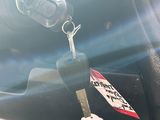 a car key that is attached to a car seat belt