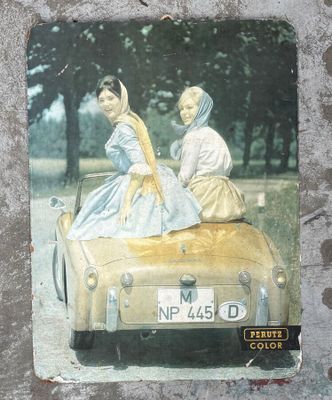 a picture of two women riding in a car