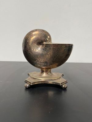 an image of a metal object sitting on top of a table