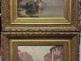 deux tableaux encadrés représentant des montagnes et un lac, avec un château en arrière-plan