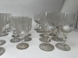 a lot of wine glasses sitting on a table