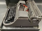 an old typewriter that is sitting on a table