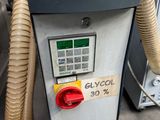a gas pump that has a hose attached to it