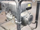 an image of a small water pump in a garage