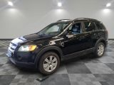 a picture of a black suv parked in a garage