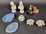 a lot of small figurines that are sitting on a table