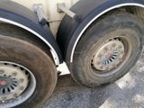 a close up of a flat tire on a truck