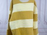 a yellow and white striped sweater on a mannequin mannequin mannequin mannequin mannequin mannequin mannequin mannequin