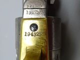 a close up of a gun that is on a wall