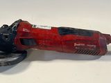 an electric angle grinder on a white surface with a white background
