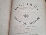 an old book that is open on a table
