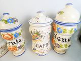 three vases with different designs on them on a table