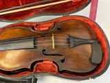 a violin in a case with a bow in it