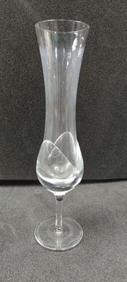 a glass vase that is sitting on a table