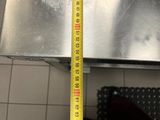 a measuring tape that is on top of a piece of metal