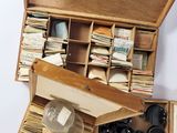 a wooden box filled with lots of old papers