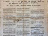 an old newspaper with a piece of paper on top of it
